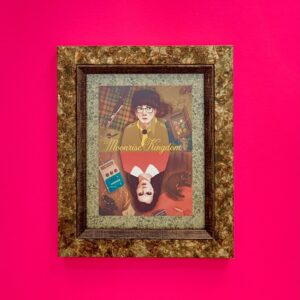 framed moonrise kingdom print outer size 24cm by 29cm. unusual mottled gold mount and frame.